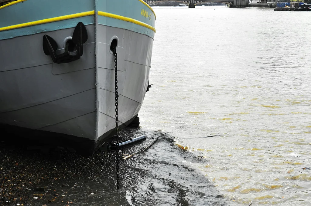 Close-up of a boat bow showing the hull shape and boat deadrise near the waterline