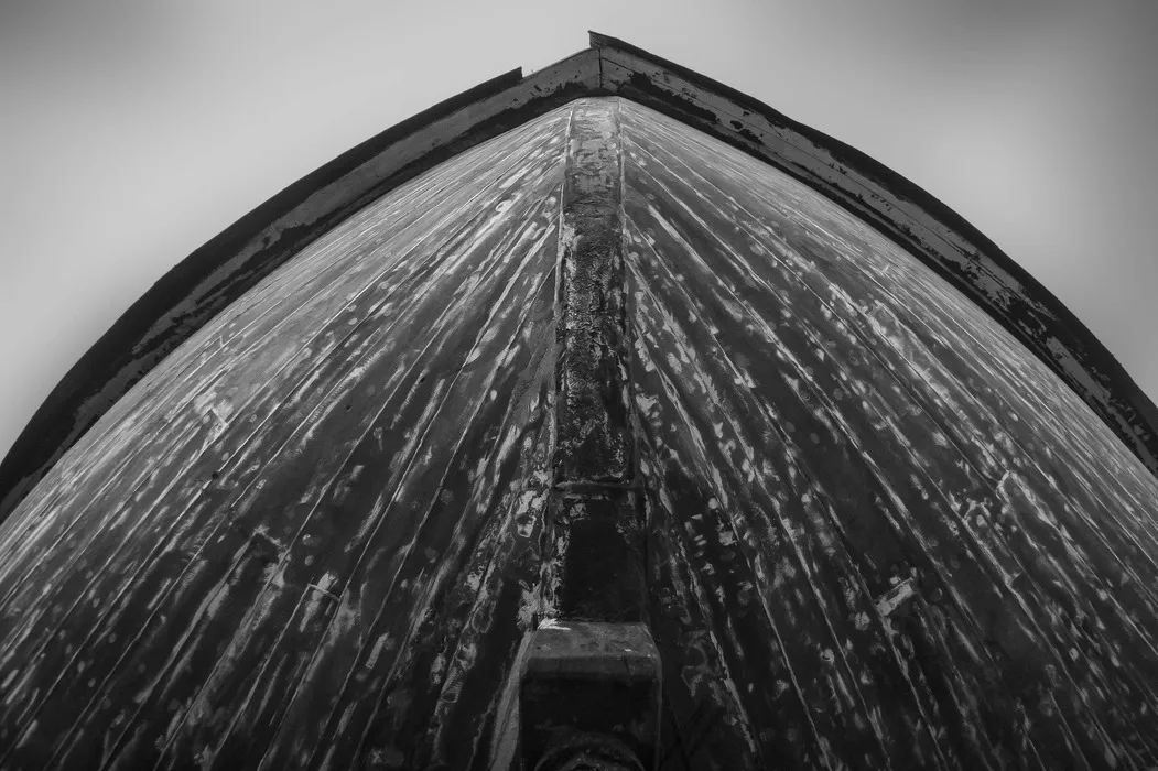 Upward view of a deep-V boat hull, showing a sharp deadrise angle along the keel